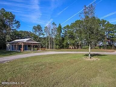 surrounding community featuring a lawn