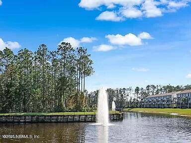 view of home's community with a water view