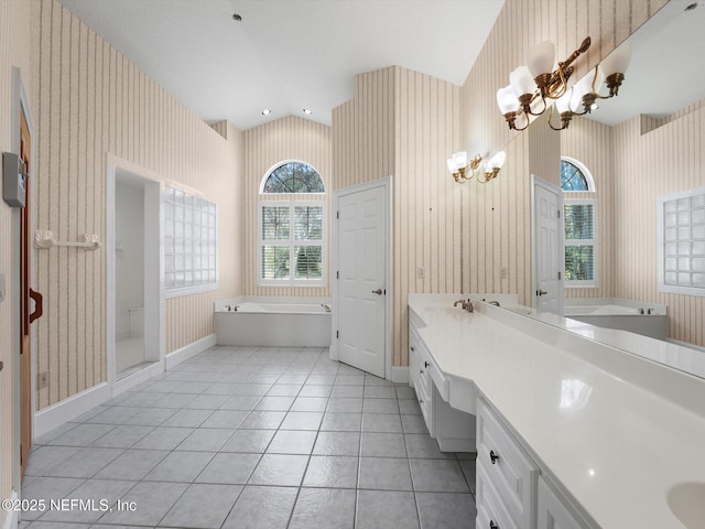 bathroom featuring an inviting chandelier, tile patterned floors, vanity, and shower with separate bathtub