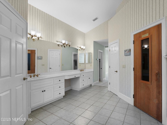 bathroom with vanity, tile patterned flooring, and a chandelier