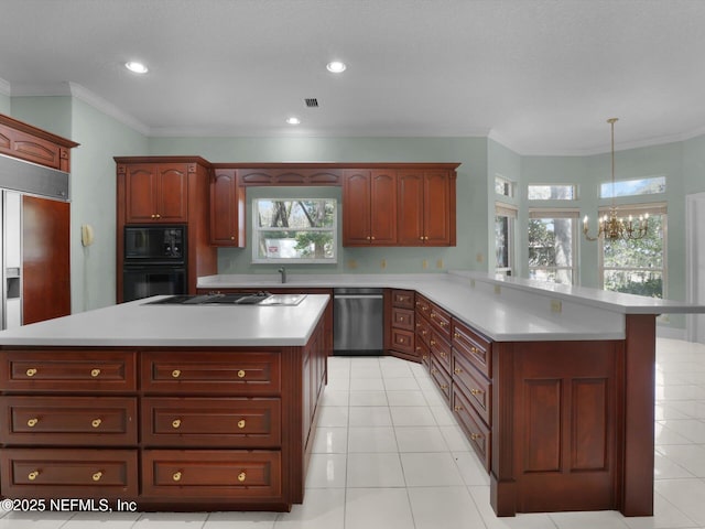 kitchen with a kitchen island, pendant lighting, kitchen peninsula, and black appliances