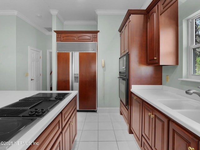 kitchen with light tile patterned flooring, sink, crown molding, and black appliances