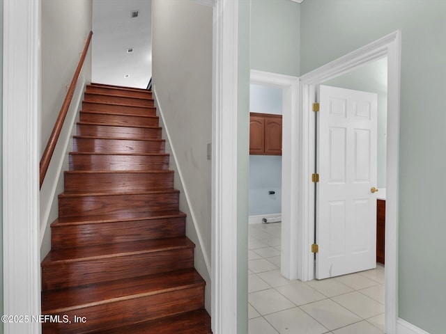 staircase with tile patterned flooring