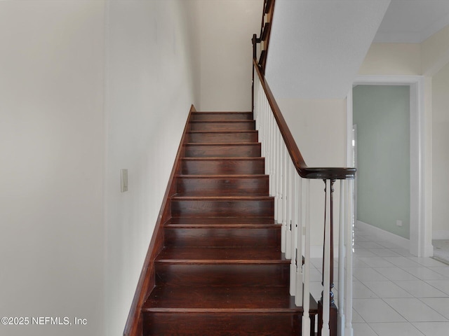 stairs with tile patterned floors