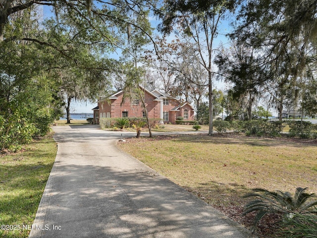 exterior space with a front yard and a water view