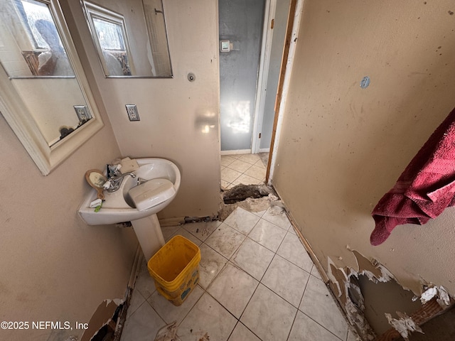 bathroom featuring tile patterned flooring and sink