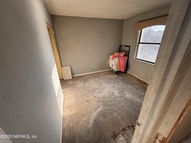 spare room featuring a textured ceiling