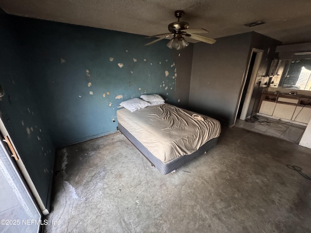 unfurnished bedroom featuring concrete flooring and a textured ceiling