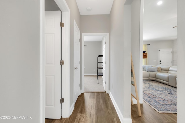 corridor with wood-type flooring