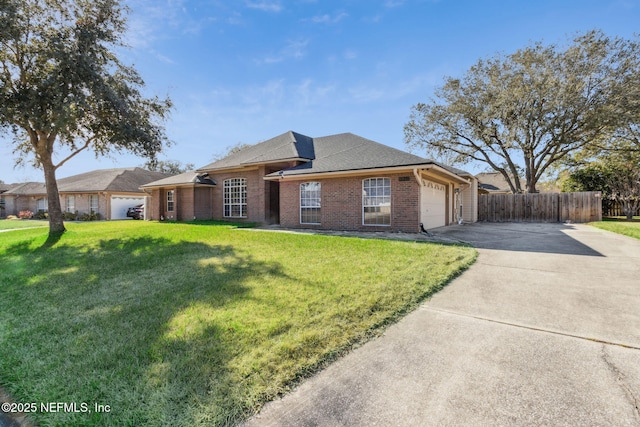 ranch-style home featuring a garage and a front lawn