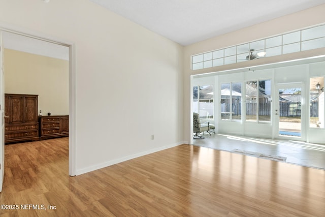 interior space with light hardwood / wood-style floors and a wealth of natural light