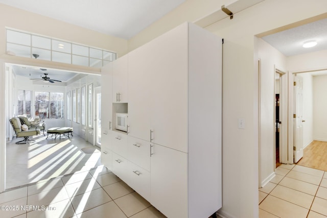 hallway with light tile patterned floors