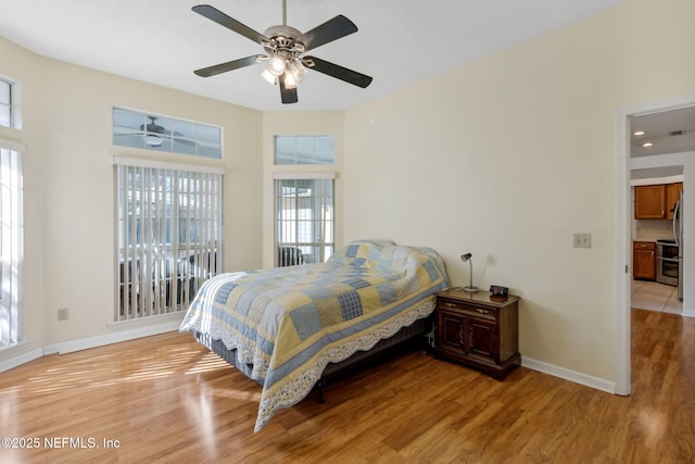 bedroom featuring light hardwood / wood-style flooring and ceiling fan