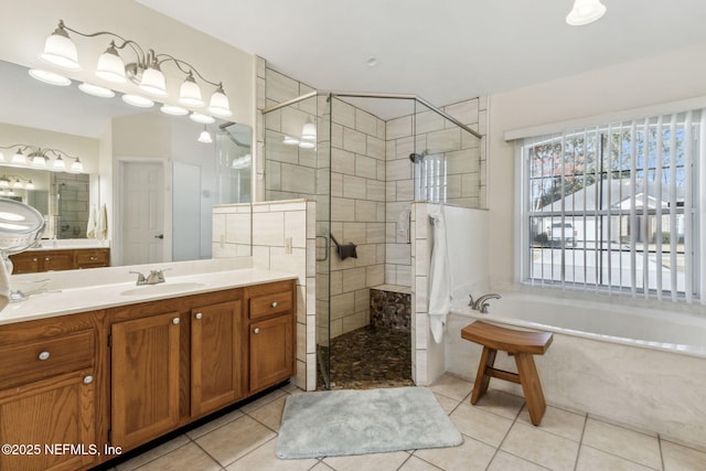 bathroom with vanity, tile patterned floors, and plus walk in shower