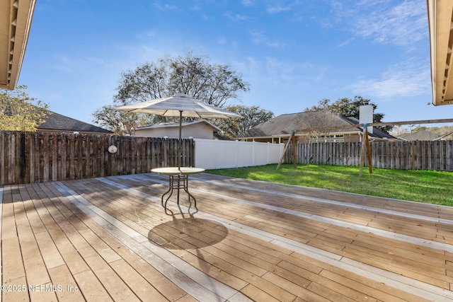 wooden deck with a yard