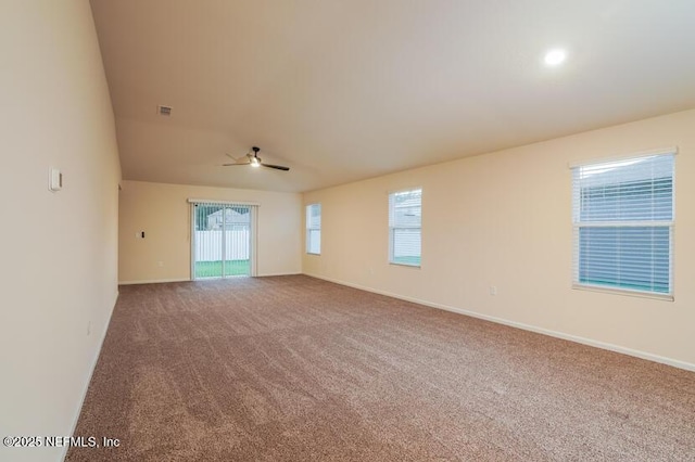 empty room featuring carpet flooring and ceiling fan