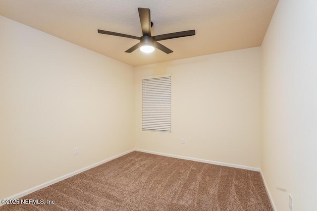 spare room featuring a textured ceiling, ceiling fan, and carpet