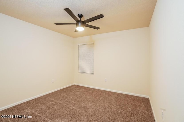 spare room with carpet, a textured ceiling, and ceiling fan