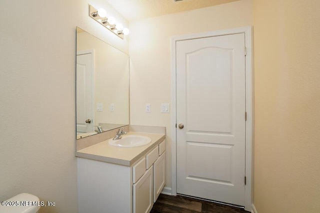 bathroom featuring vanity and wood-type flooring