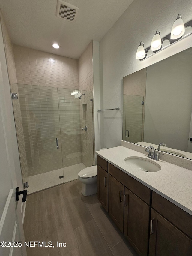 101 Erlking Ct, Saint Johns, FL 32259 - bathroom featuring vanity, wood finished floors, a stall shower, and recessed lighting