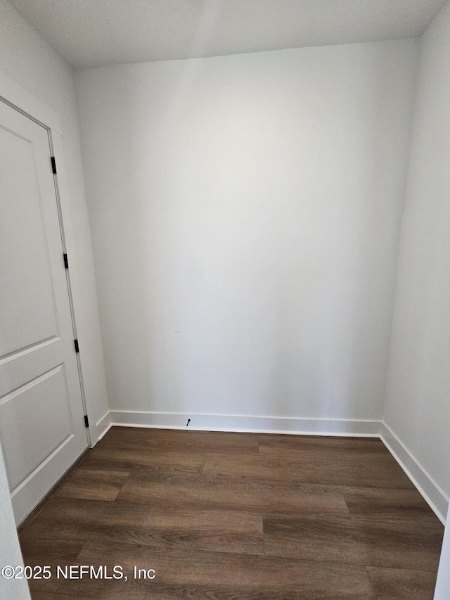 101 Erlking Ct, Saint Johns, FL 32259 - spare room featuring dark wood-style flooring and baseboards