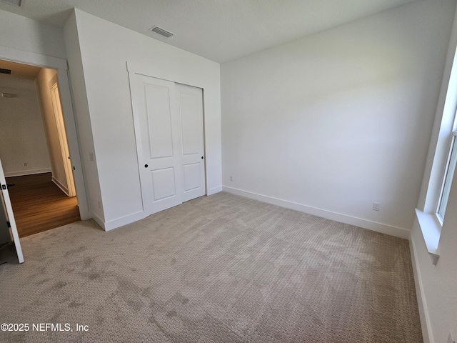 101 Erlking Ct, Saint Johns, FL 32259 - unfurnished bedroom featuring light carpet and a closet