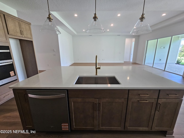 101 Erlking Ct, Saint Johns, FL 32259 - kitchen featuring dishwasher, recessed lighting, a tray ceiling, a textured ceiling, and open floor plan