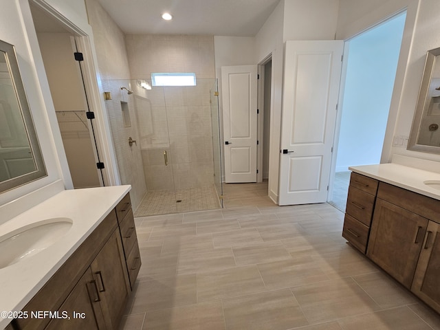 101 Erlking Ct, Saint Johns, FL 32259 - bathroom featuring a shower stall, two vanities, a closet, and recessed lighting