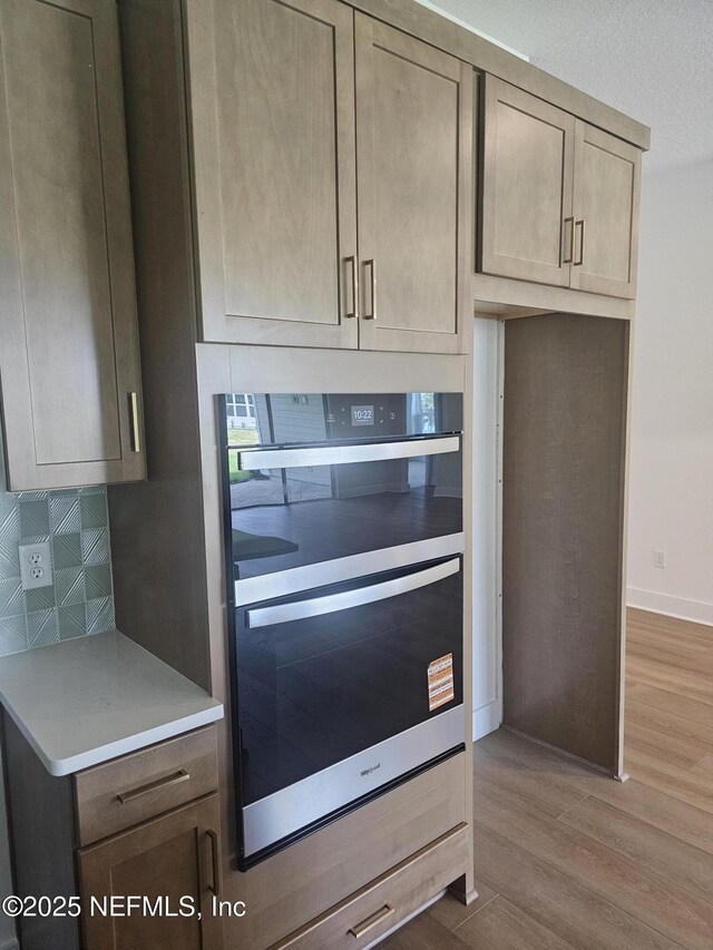 101 Erlking Ct, Saint Johns, FL 32259 - kitchen featuring wood finished floors, tasteful backsplash, and light countertops