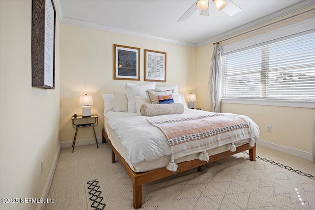 carpeted bedroom featuring crown molding and ceiling fan