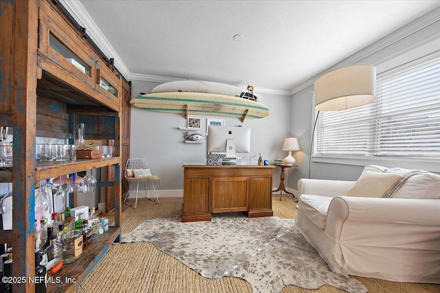 home office featuring ornamental molding, hardwood / wood-style floors, and a textured ceiling