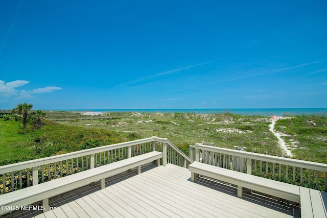 wooden terrace with a beach view and a water view