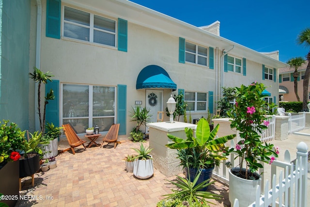 view of front of home featuring a patio