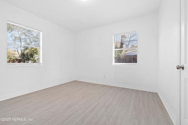 spare room featuring light hardwood / wood-style flooring