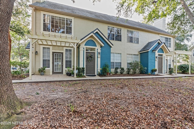 view of front of house with a pergola