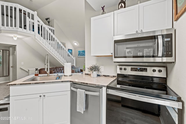 kitchen with white cabinetry, appliances with stainless steel finishes, and sink