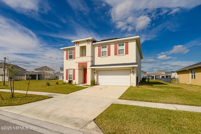 view of front of house featuring a garage and a front lawn