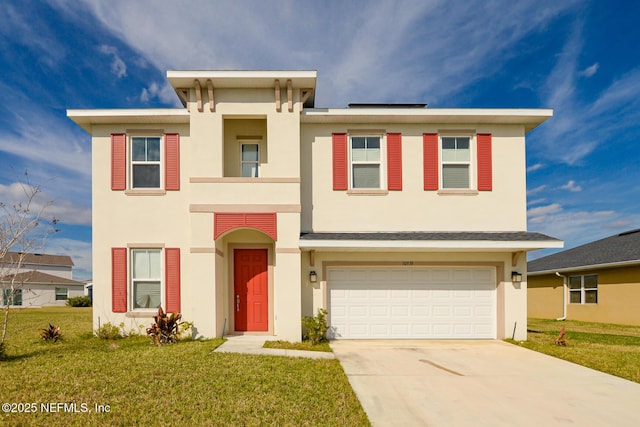 view of front of house featuring a garage and a front lawn