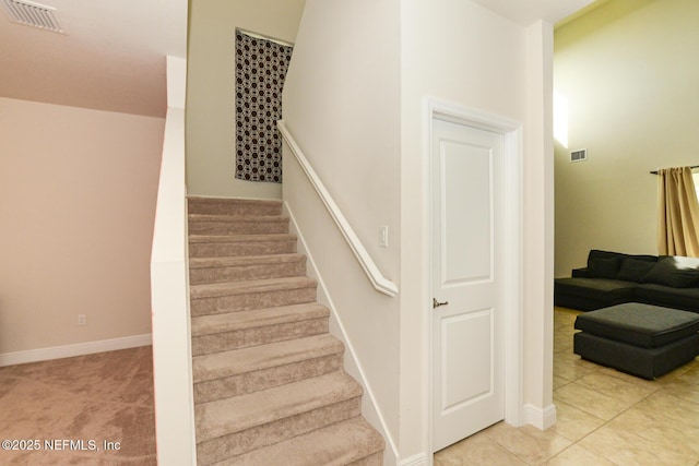 stairway featuring tile patterned floors