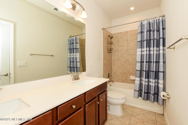 full bathroom featuring shower / tub combo, vanity, tile patterned floors, and toilet