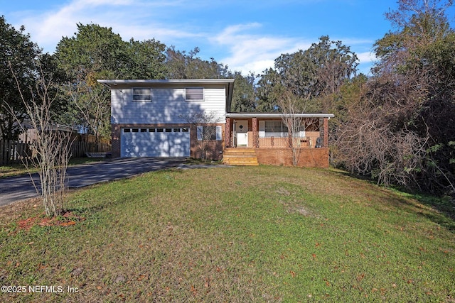 view of property with a garage and a front yard