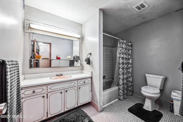 full bathroom featuring tile patterned flooring, vanity, toilet, shower / bath combo, and a textured ceiling