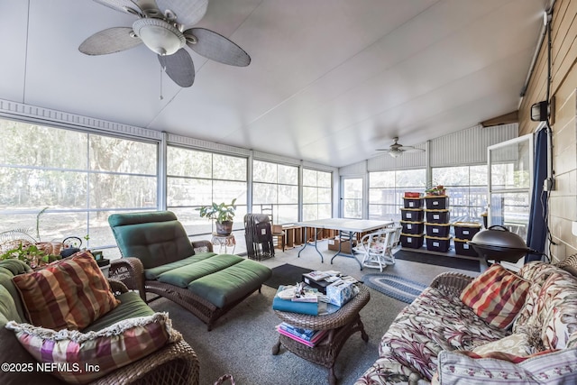 sunroom / solarium with ceiling fan and vaulted ceiling