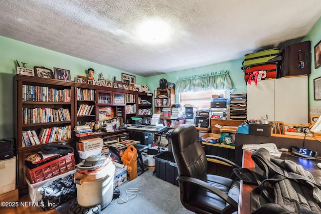 office space with carpet and a textured ceiling