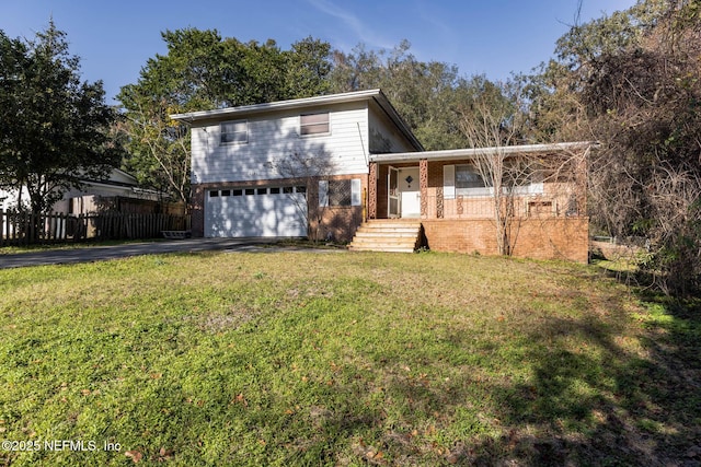 view of front facade with a garage and a front yard