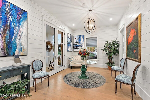 interior space with french doors and a notable chandelier