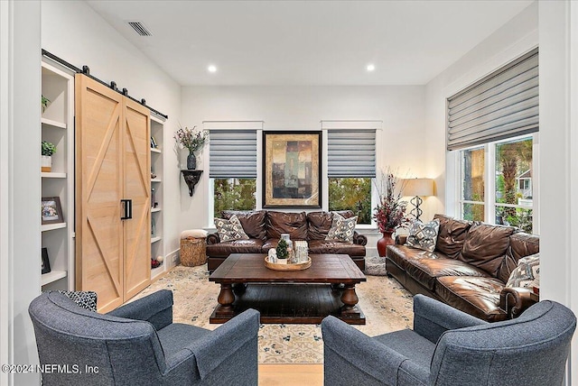 living room featuring a barn door