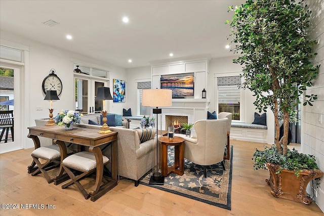 living room with light hardwood / wood-style flooring and french doors