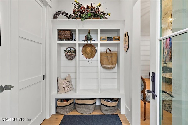 mudroom with light hardwood / wood-style floors