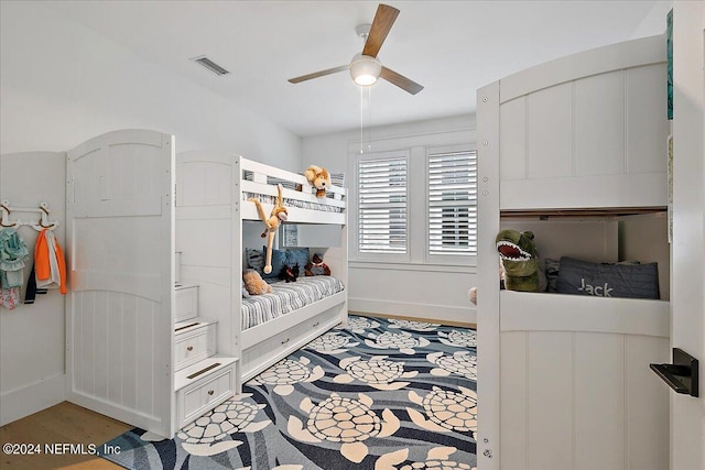 bedroom with light hardwood / wood-style flooring and ceiling fan